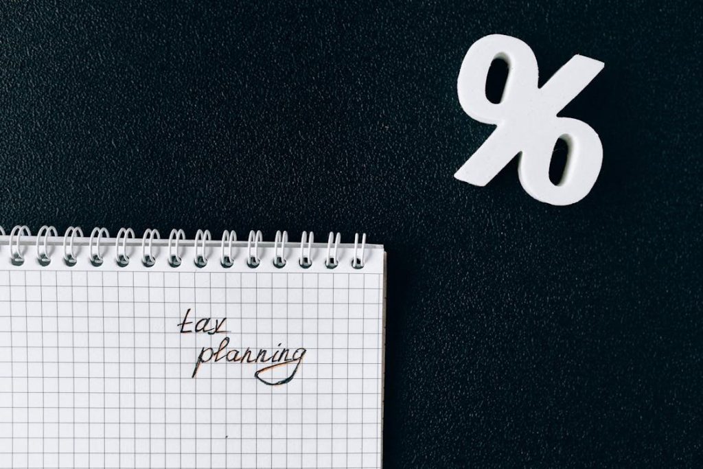 A small notebook with the word tax planning on it.